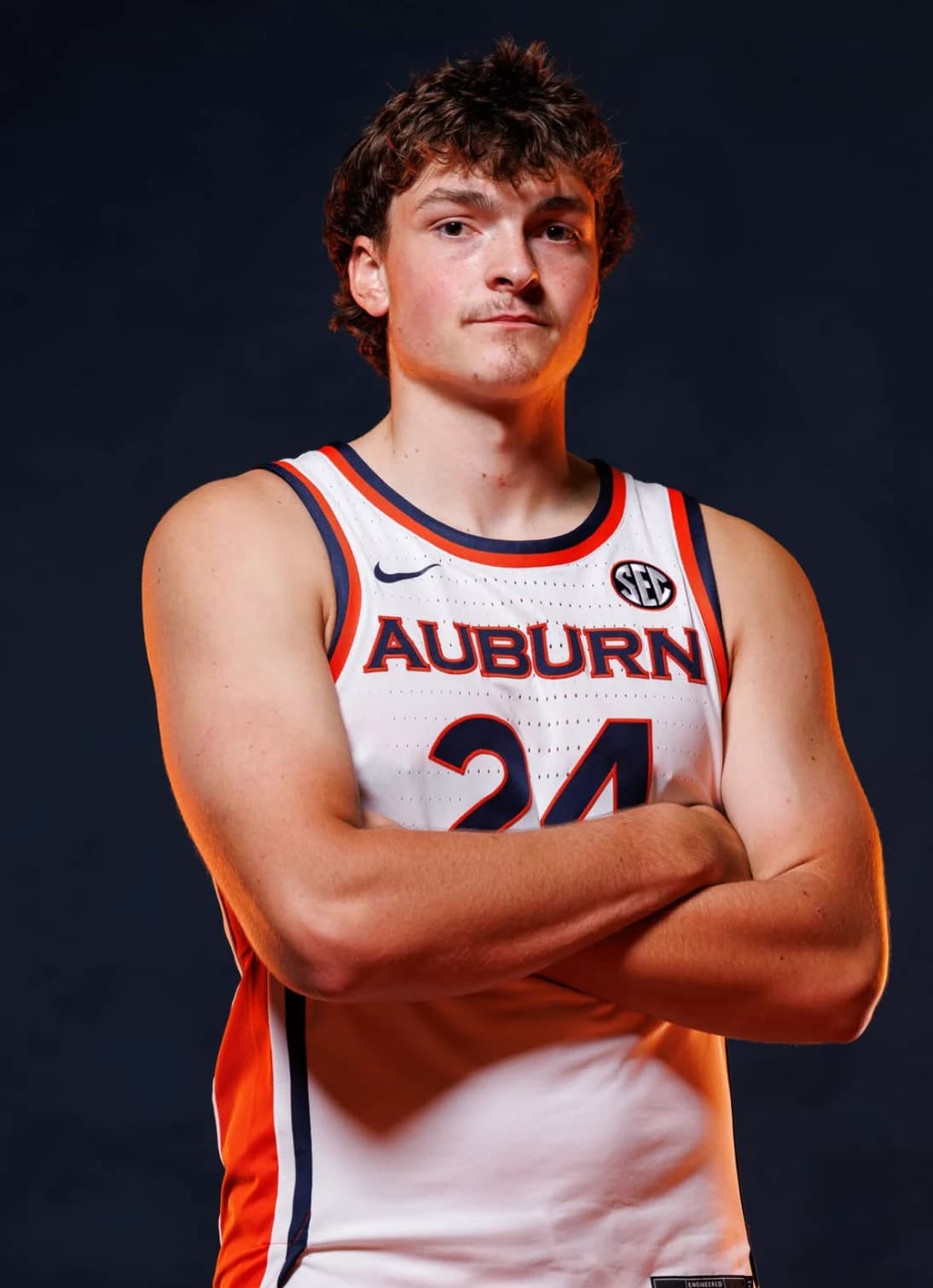 Adam Olsen wearing his white Auburn number 24 jersey